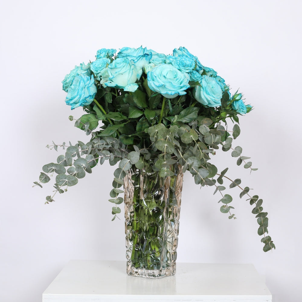 Blossoms in Harmony:  The Dance of the Blue Rose and Eucalyptus.